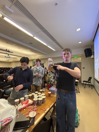 Luke Hattrup running a hot chocolate table at an Elevation Oregon event